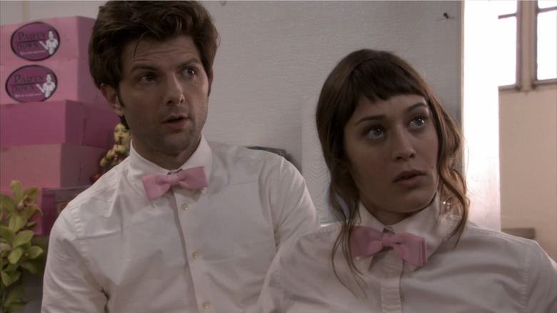 Adam Scott and Lizzy Caplan look surprised