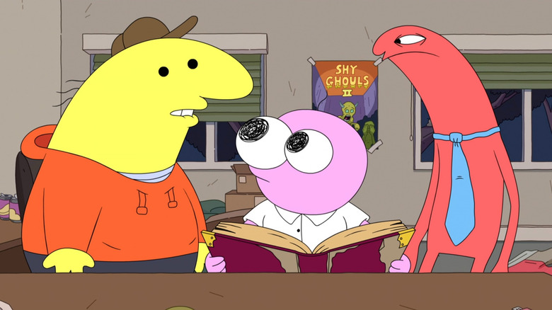 Charlie, Pim, and Allan reading a book on Smiling Friends