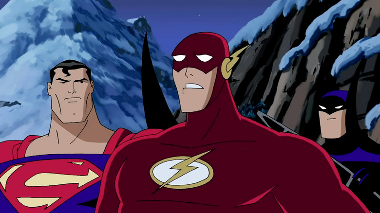 The Flash stands shocked beside Superman and Batman in Justice League (2001-2004)