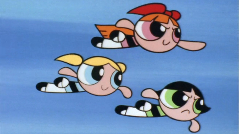 The Powerpuff Girls flying through the air