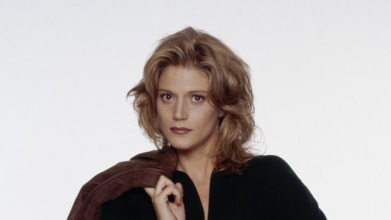 Alex Lambert holding her coat