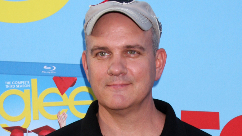 Mike O'Malley wears a hat