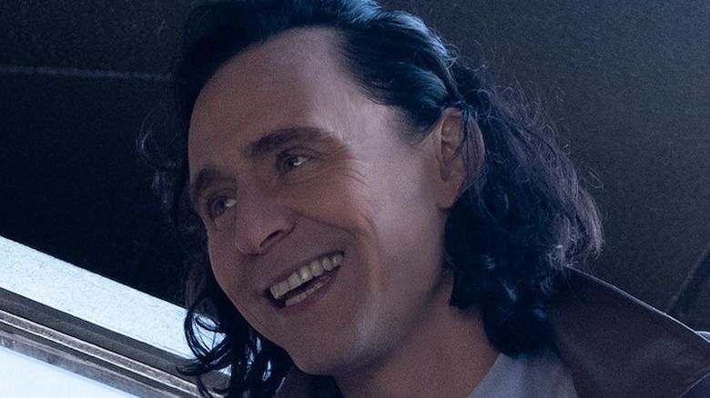 Tom Hiddleston as Loki smiling