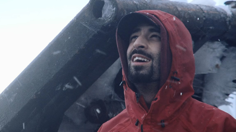 Josh Harris smiling in precipitation