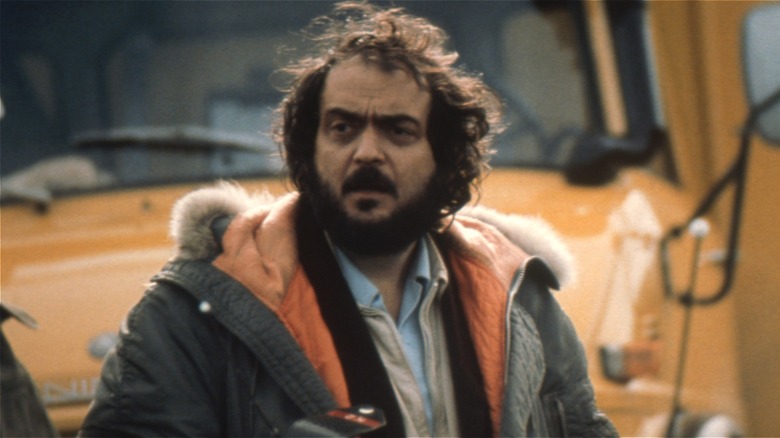 Stanley Kubrick looking thoughtful on The Shining set