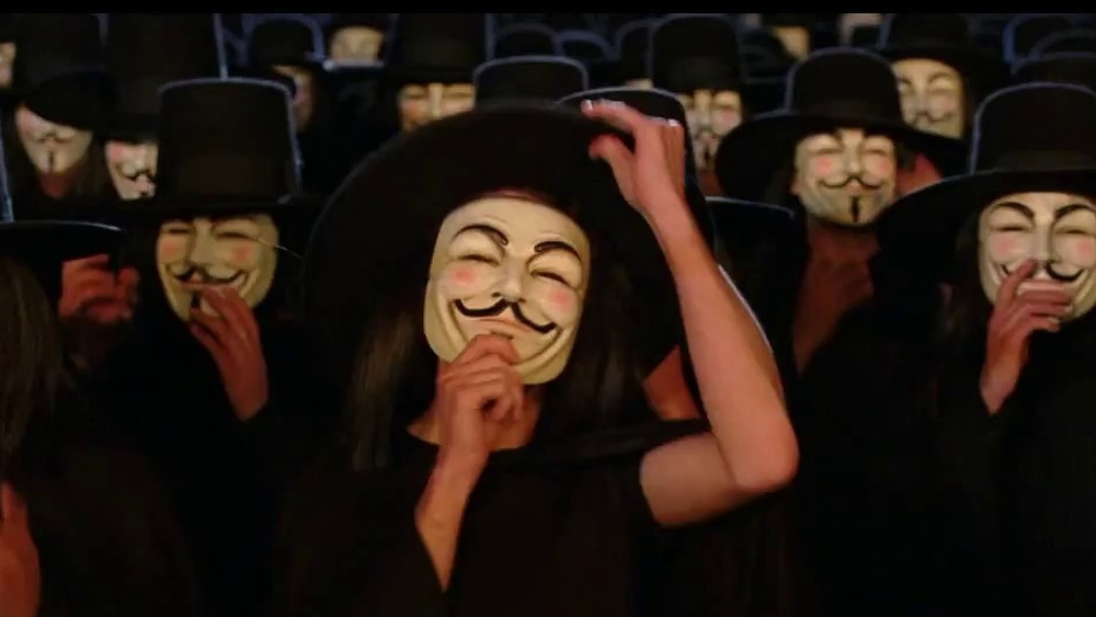 Mob in Guy Fawkes masks