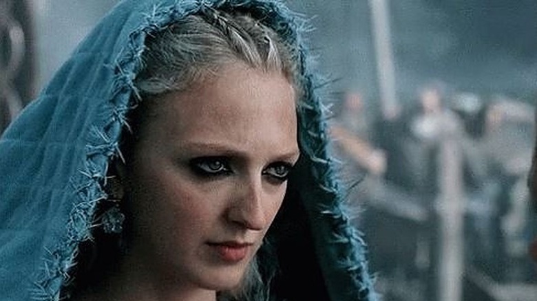 Torvi with a hood on, looking concerned