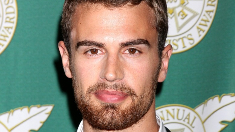 Theo James smirking