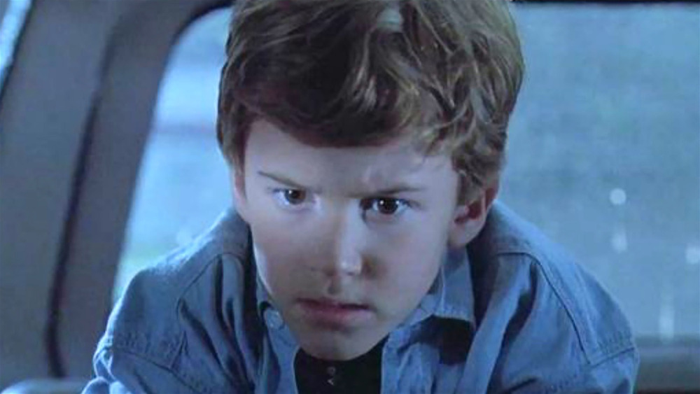 Young Tim from Jurassic Park concentrating on something off-camera