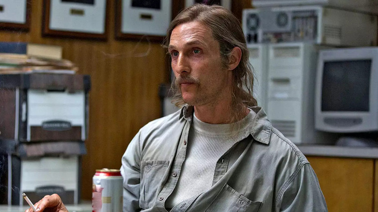 Rust Cohle smokes and drinks during his interrogation in 