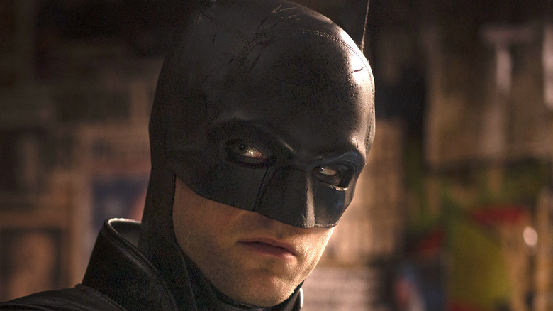 Batman wears black cowl