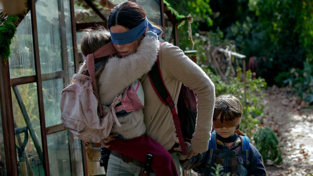 Sandra Bullock, Vivian Lyre Blair, and Julian Edwards in Bird Box