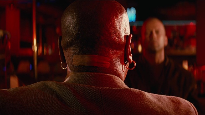 Marsellus Wallace from behind showing large bandage on back of neck in Pulp Fiction (1994)