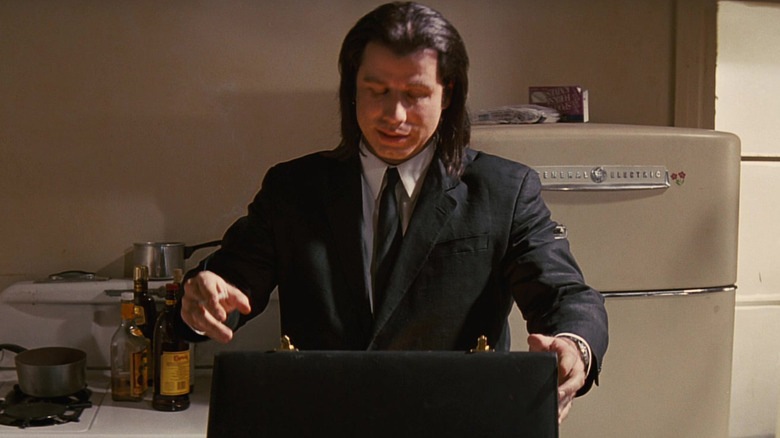 Vincent Vega opening Marsellus' briefcase in Marvin's kitchen in Pulp Fiction (1994)