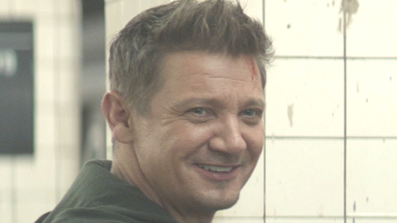 Hawkeye smiling in subway station