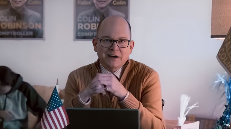 Colin Robinson sitting in front of computer