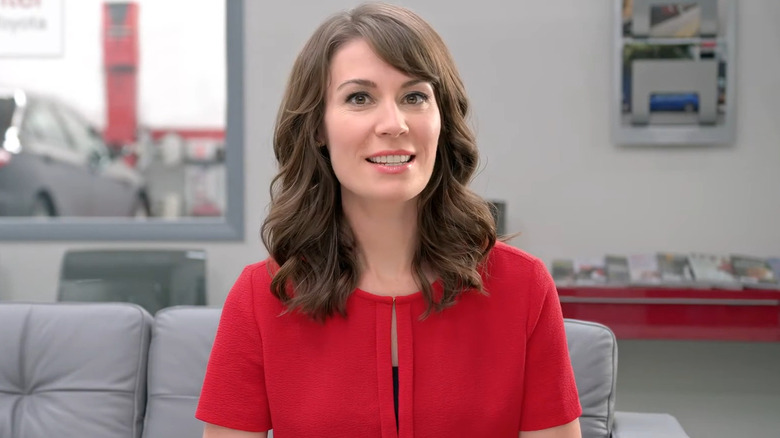 Jan smiles in the Toyota waiting room in a Toyota commercial