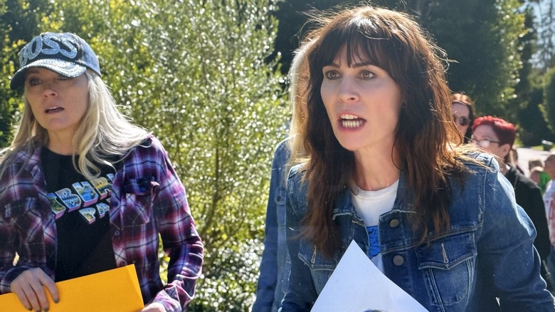Laurel Coppock as a vigil-goer in Curb Your Enthusiasm