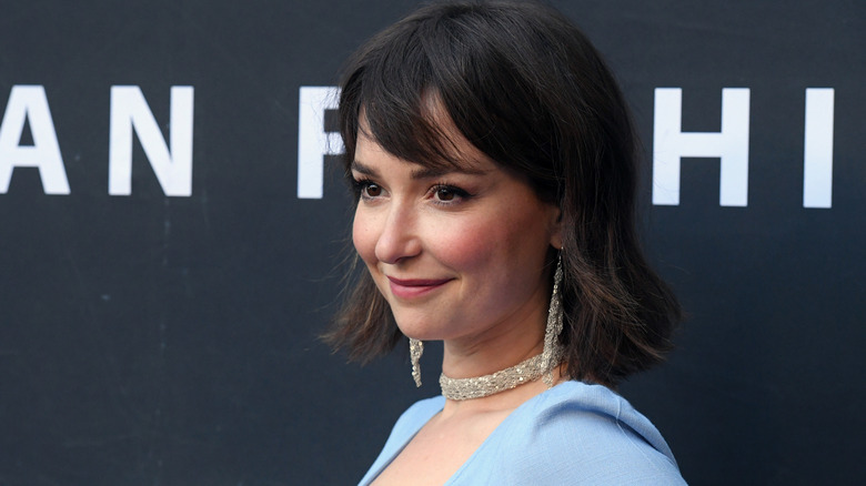 Milana Vayntrub posing in blue top