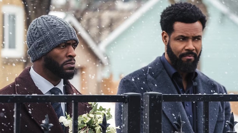 Aldis Hodge as Cross and Isaiah Mustafa as John Sampson in a snowy scene from Cross