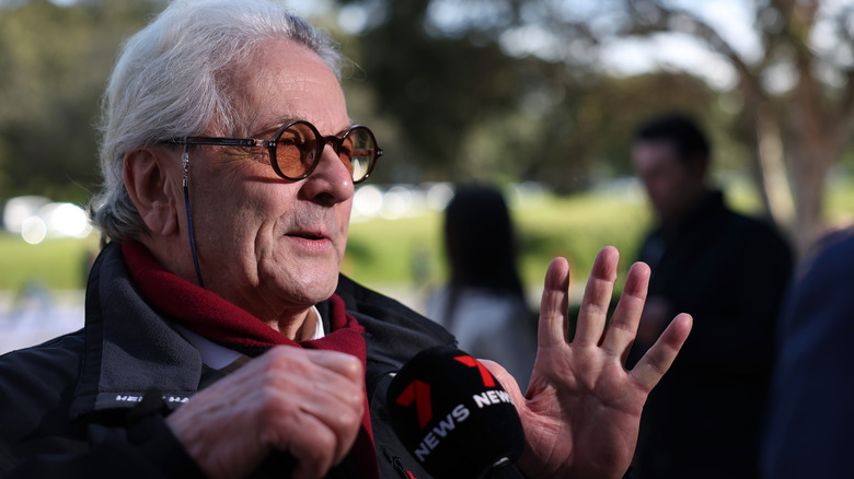 George Miller talking to reporter