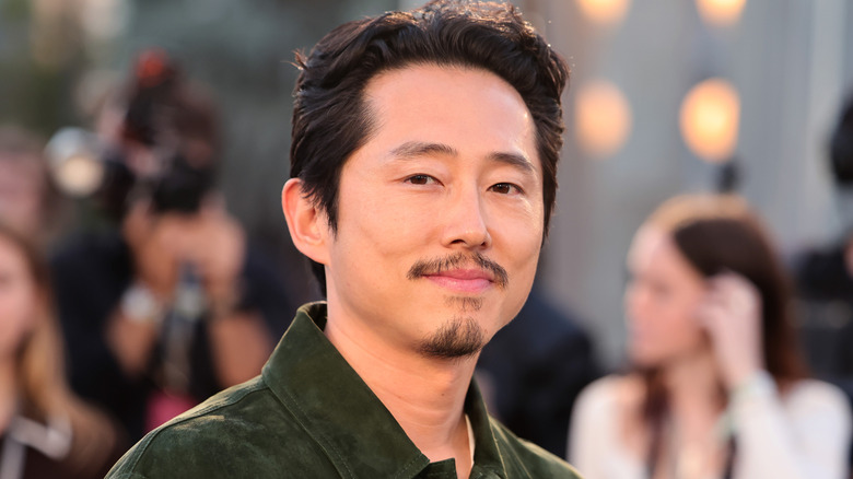 Steven Yeun wearing glasses