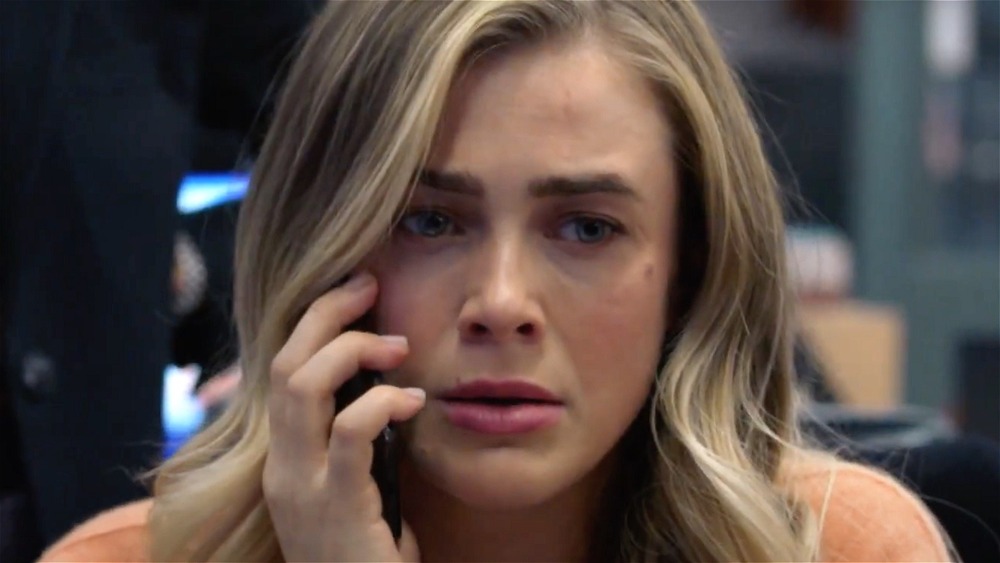 Michaela Stone looking concerned while on the phone