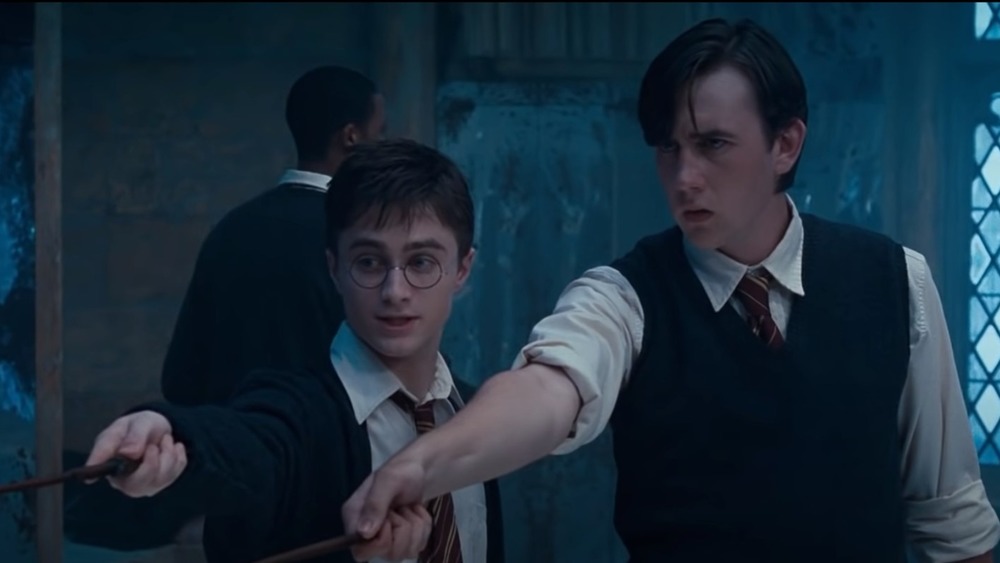 Neville Longbottom and Harry Potter practicing magic