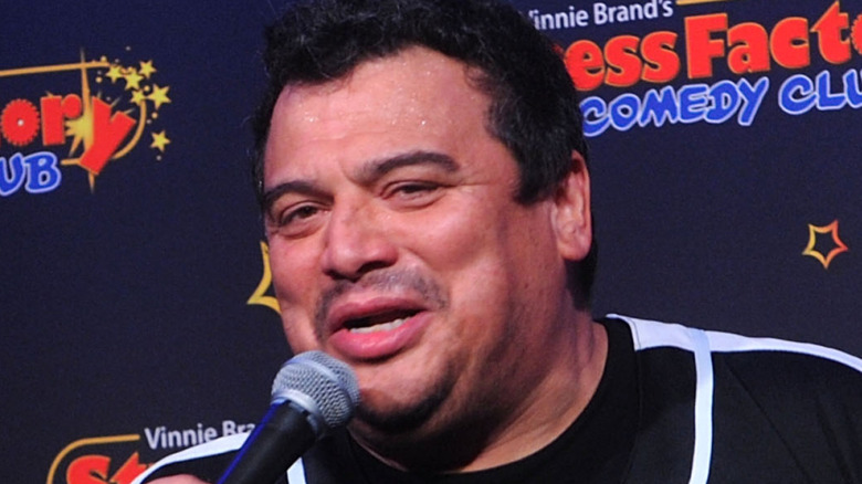 Mencia performing stand up comedy