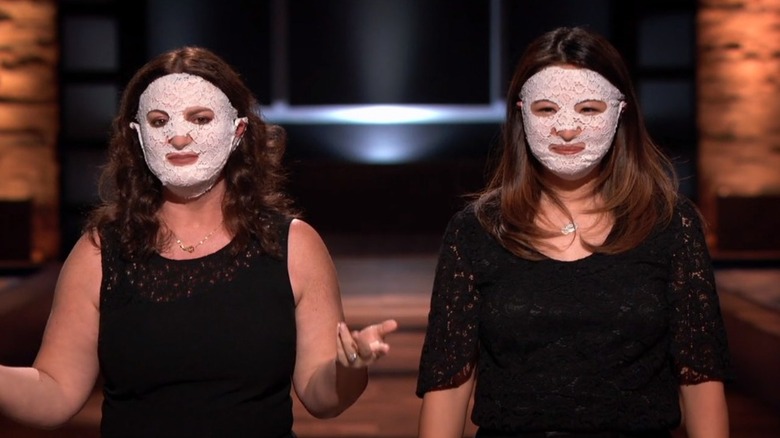 Anita Sun Eisenberg and Mariella Scott demonstrating their masks