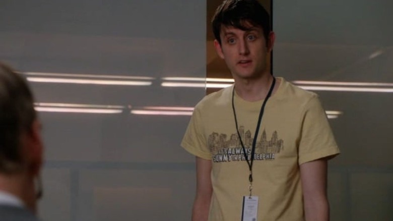 Zach Woods looking on