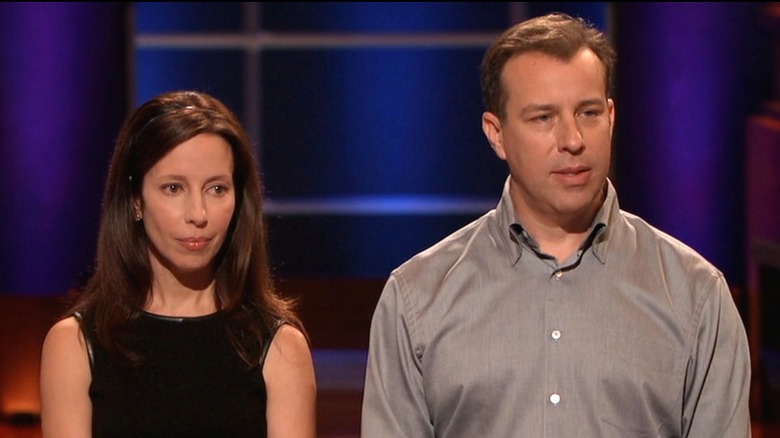 Julie and Brian Whiteman standing and looking serious