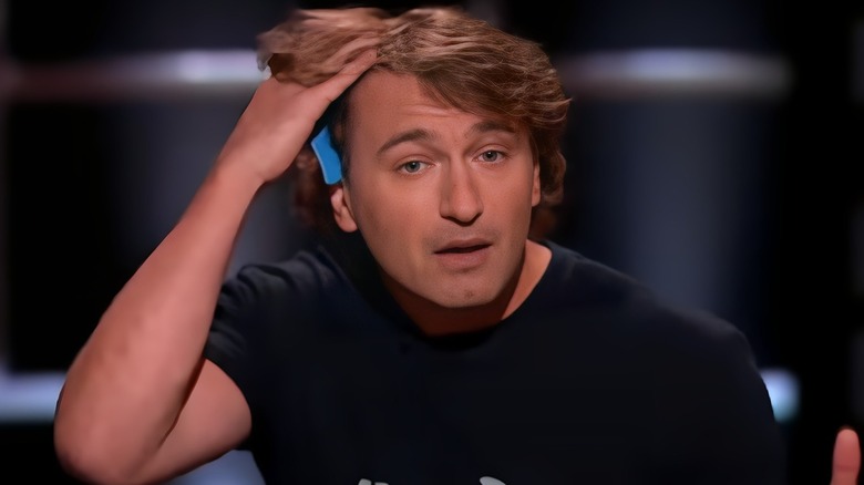 Tony Litwinowicz holding his hair