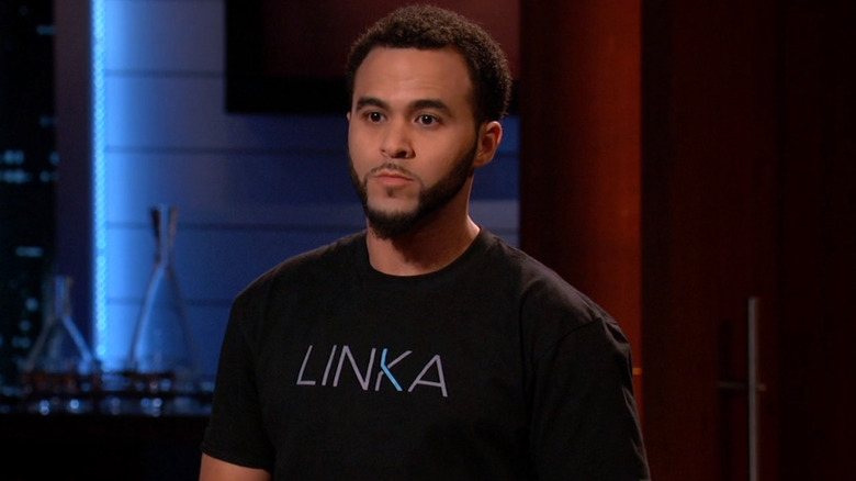 Mohamed wearing a LINKA t-shirt