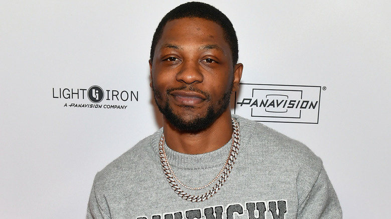 Bobb'e J. Thompson in a grey sweater and silver chain