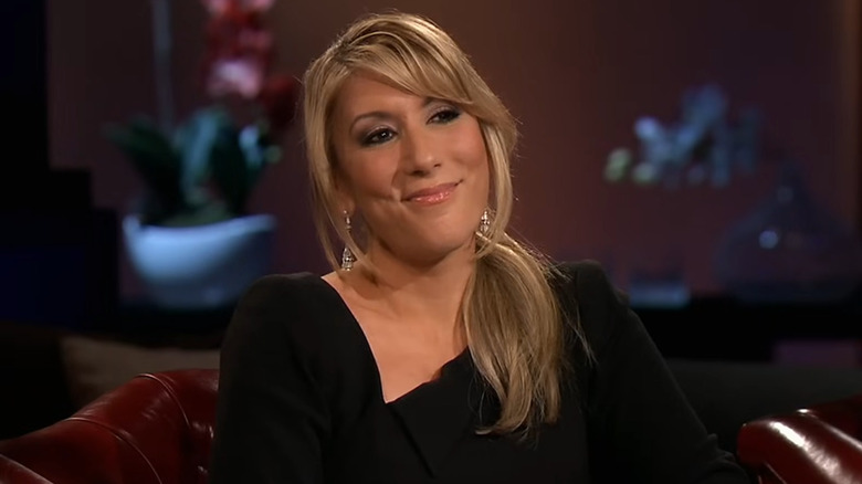 Lori Greiner leaning and smirking on "Shark Tank"