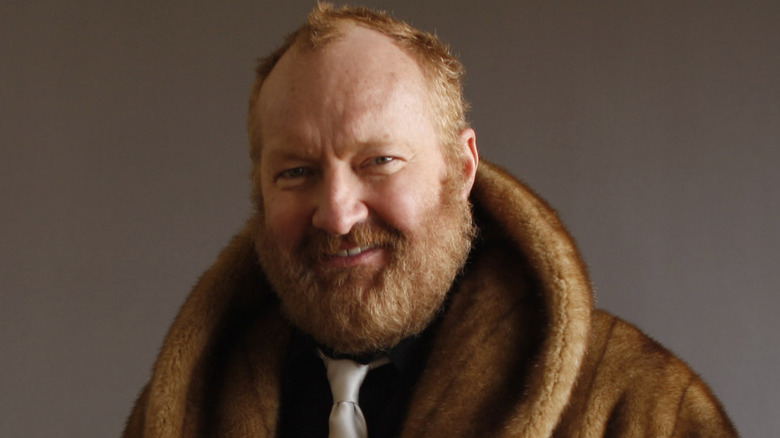 Randy Quaid in fur coat