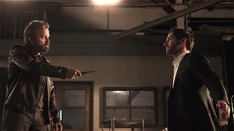 Vincent Le Mec threatening Lucifer with a knife