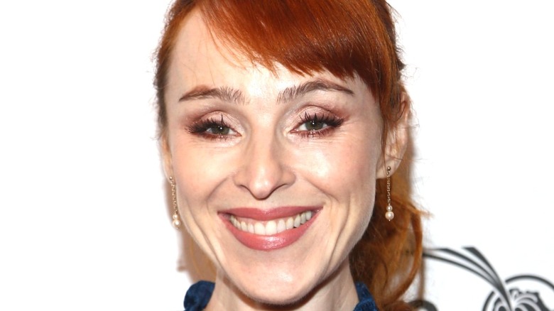 Ruth Connell smiling on red carpet