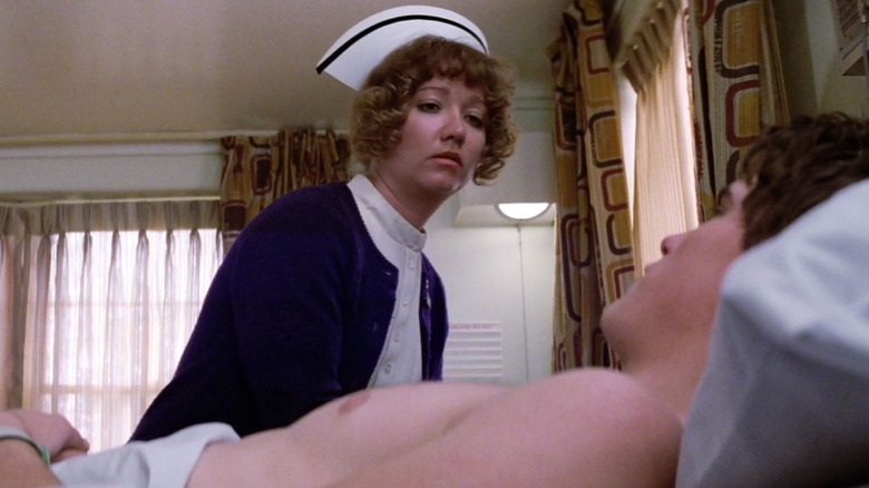 The nurse talking to Dallas in the hospital