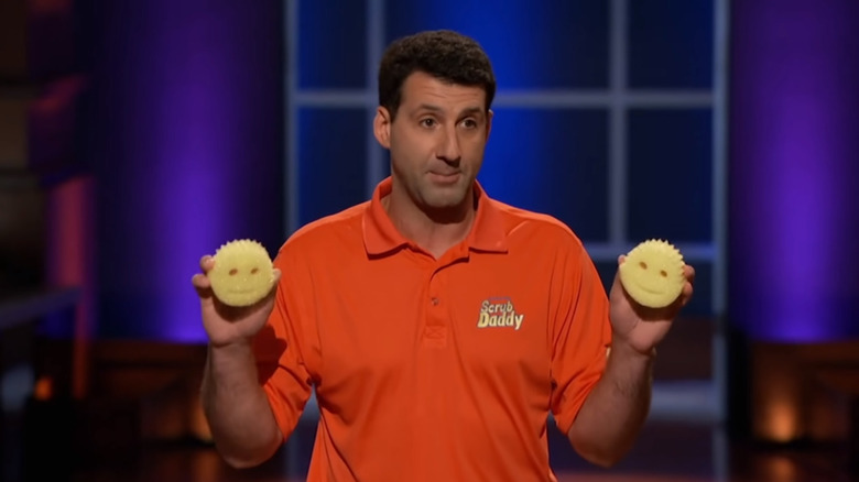 Aaron Krause holding two Scrub Daddy sponges