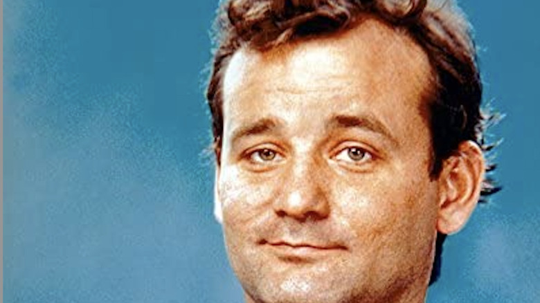 Bill Murray smiles, points 