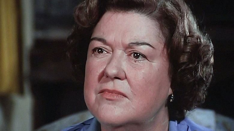 Peggy Rea listens carefully while tilting her head up