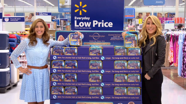 Tara and Lori standing at Sleep Styler display in Walmart