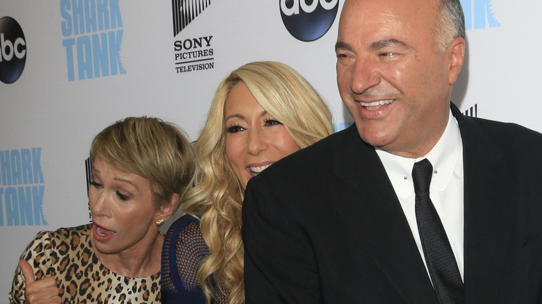 Kevin O'Leary, Lori Greiner, & Barbara Corcoran smiling together