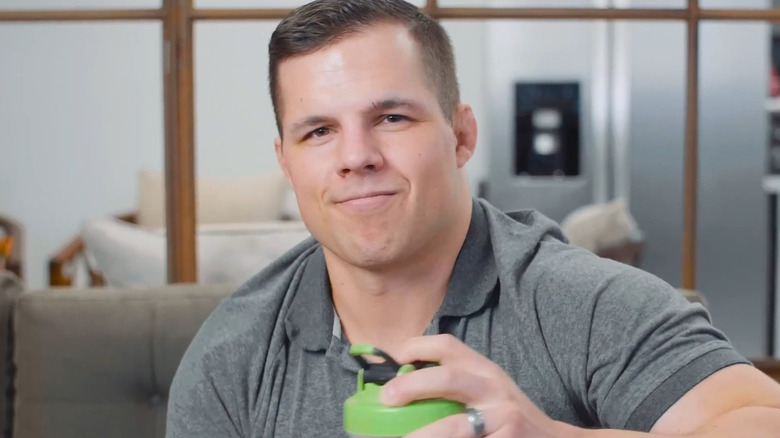 Joe Johnson smiling as he shakes up a Vade