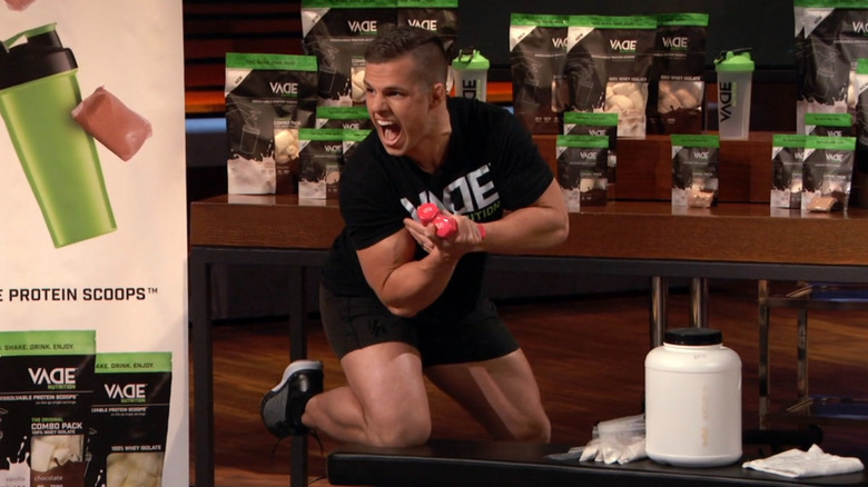 Joe lifting weights on Shark Tank