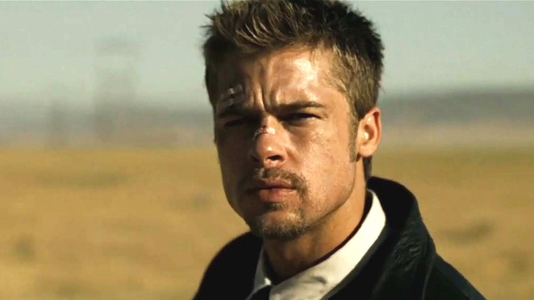 Detective Mills looks to his partner in a field in Seven (1995)