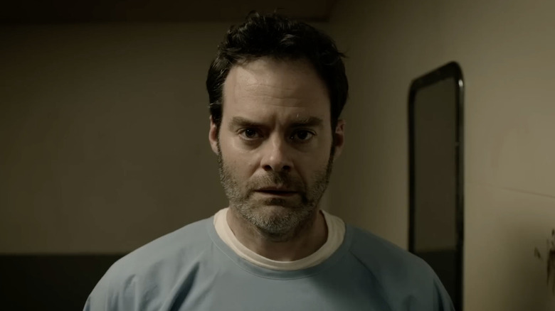 Barry Berkman wearing blue prison uniform