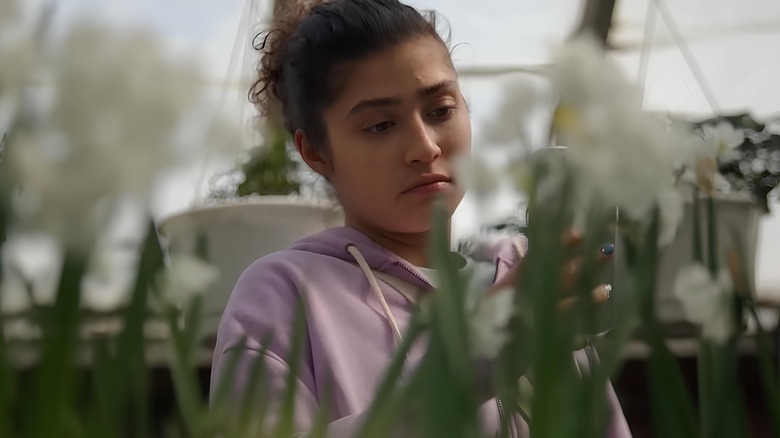Woman looking at plants